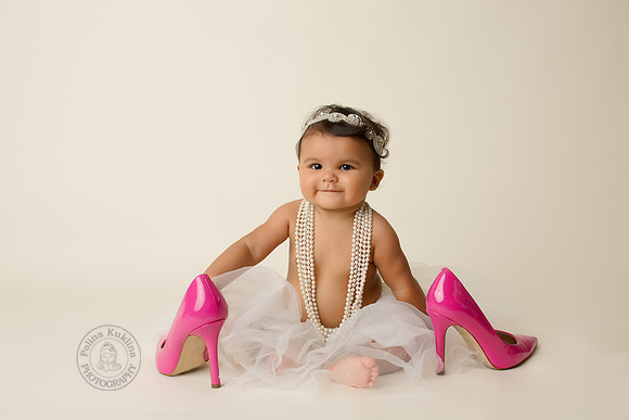 6 months photography session in a studio with mom's shoes